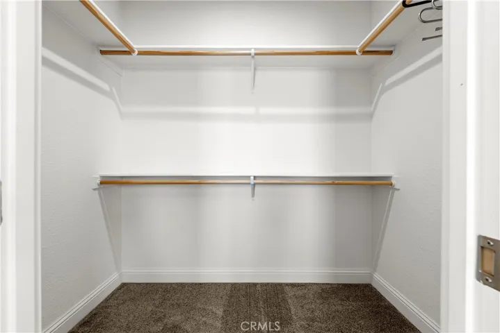 Walk in closet in primary bedroom
