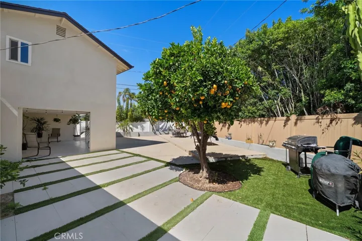 Large private backyard with multiple zones and storage. Low maintenance, made for entertaining.