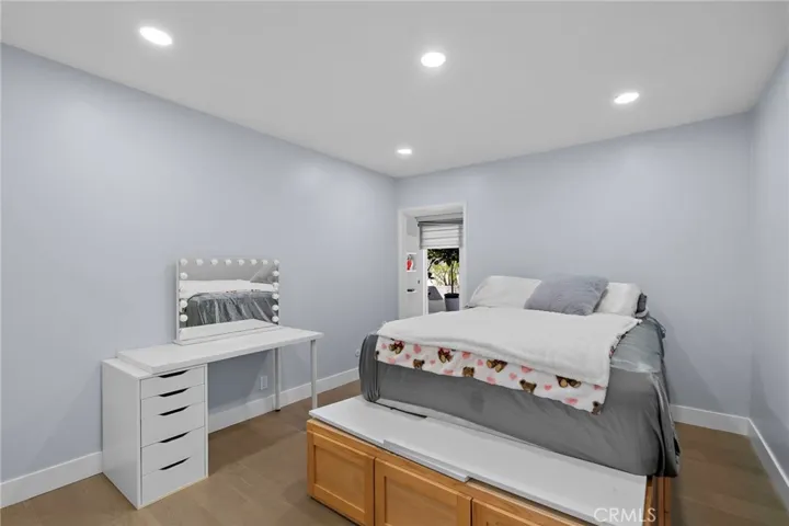 Bedroom 2 on main level with private entrance and half bath