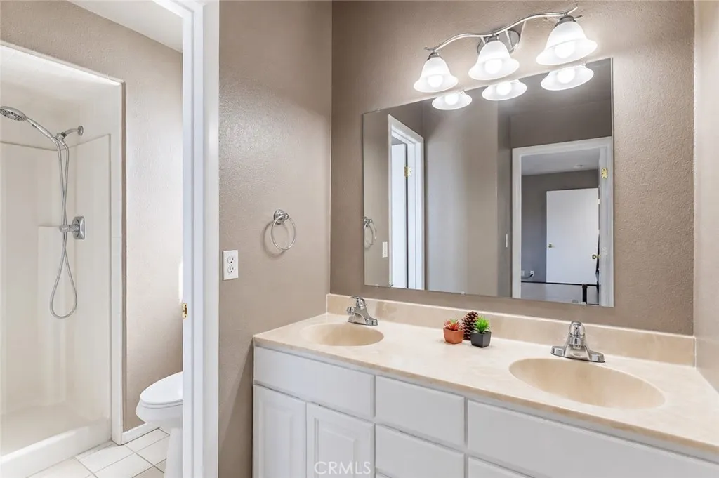 Convenient Jack-and-Jill bathroom connecting the first and second bedrooms on the third level, offering privacy and easy access.