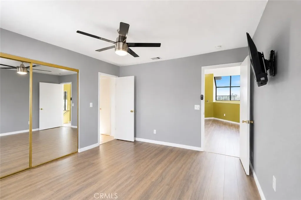 First bedroom on the third level, offering a comfortable and private living space.