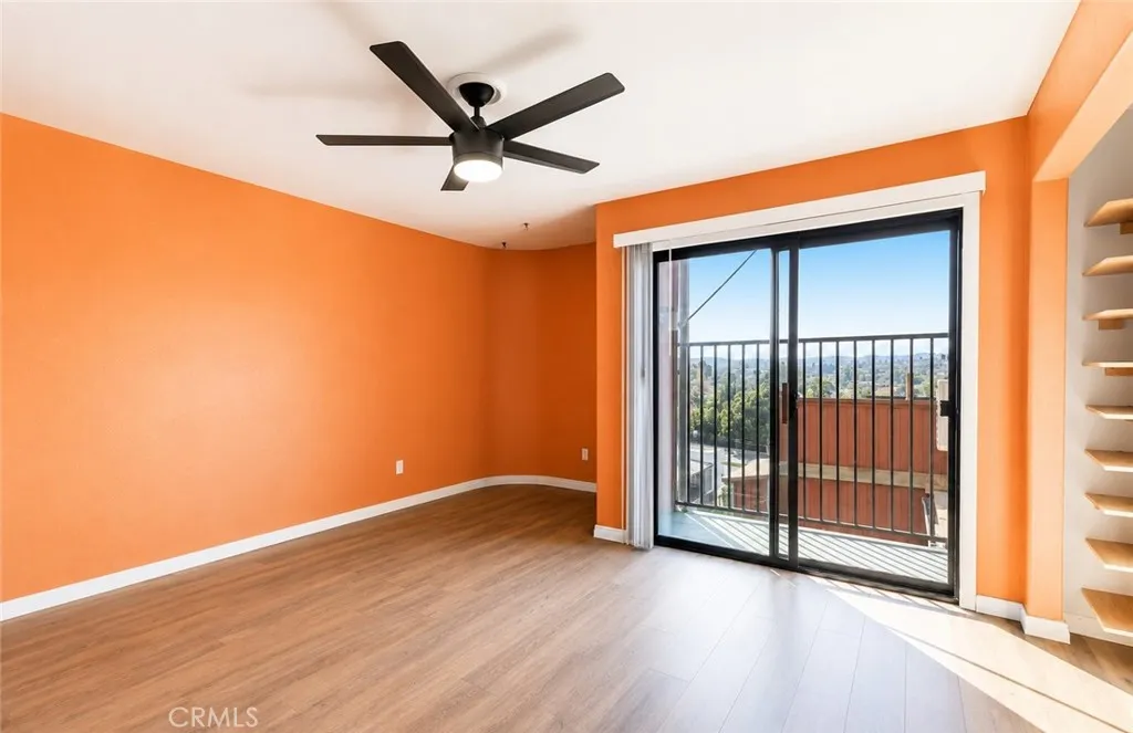 Another view of the third-level primary suite, showcasing access to its private balcony and outdoor retreat.