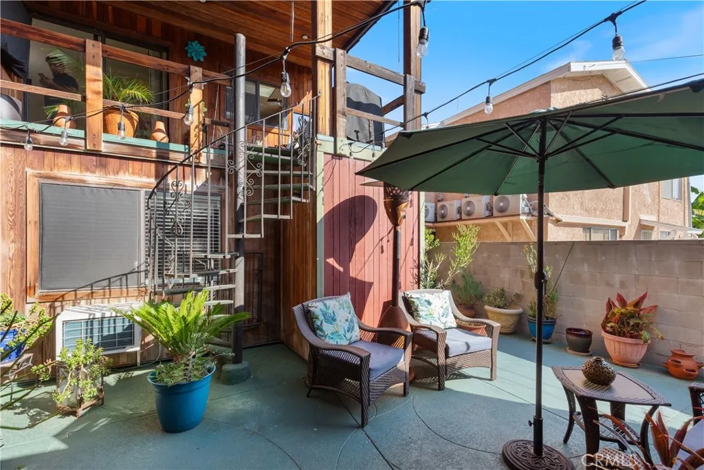 The first-level courtyard leads to both additional units and offers a relaxing space to enjoy your morning coffee. The spiral staircase leads directly to the main home on the second level.
