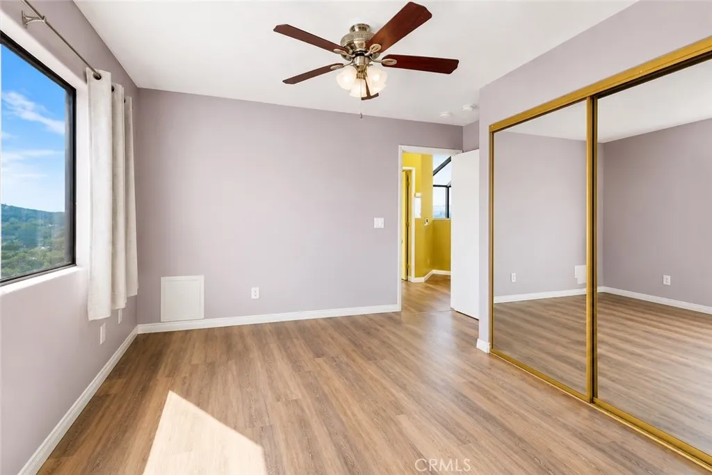 Second bedroom on the third level, offering a comfortable and versatile space to make your own.