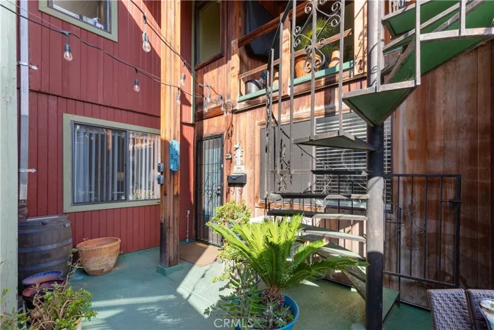 Front entrance view of Unit #1, offering private access and a welcoming entry into the living space.