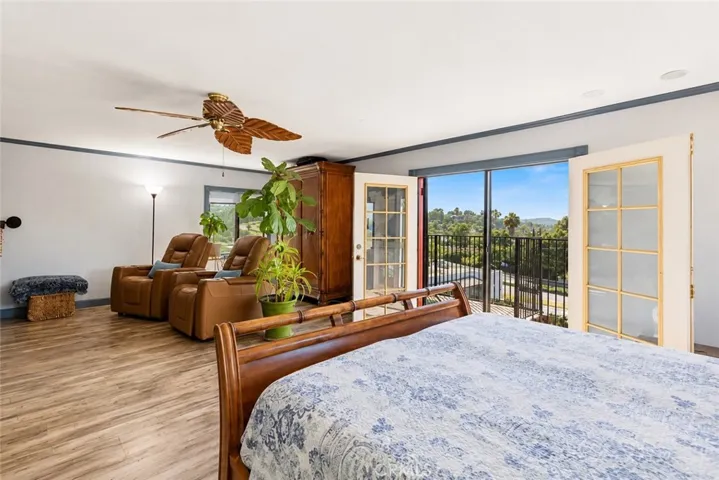 Another view of the spacious primary suite, featuring a private bathroom and additional flexible space to make your own.