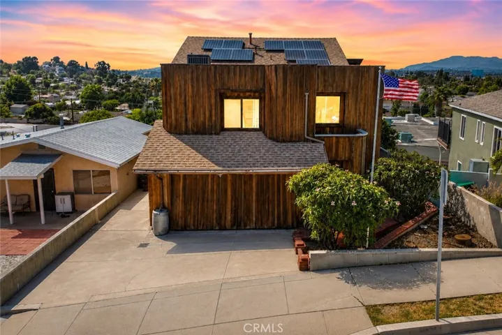 To the right, you’ll find the private entrance to the main home, located on the second level of the property.