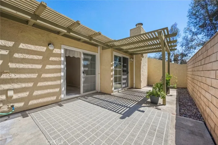 There is a custom built patio cover to provide shade and opportunities to hang lighting, etc.