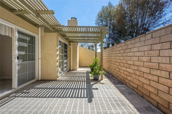 There is a custom built patio cover to provide shade and opportunities to hang lighting, etc.