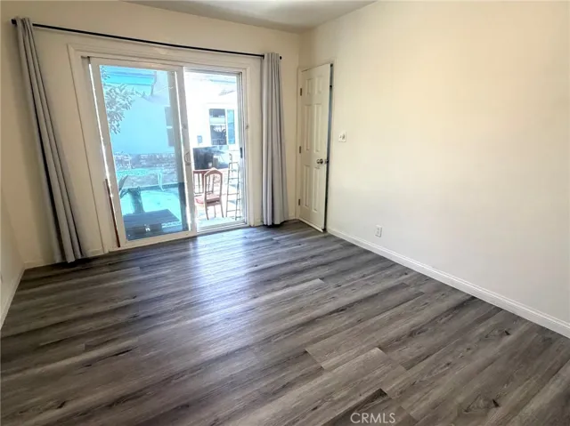Primary bedroom with a slide door to the back yard