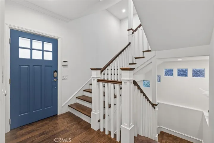 Entry at 2nd floor, stairs leading down to the garage and bonus room