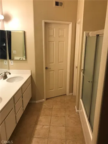 Another view of Primary Bathroom. Walk In Closet straight ahead.