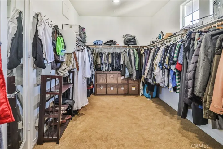 Walk in closet, primary bedroom