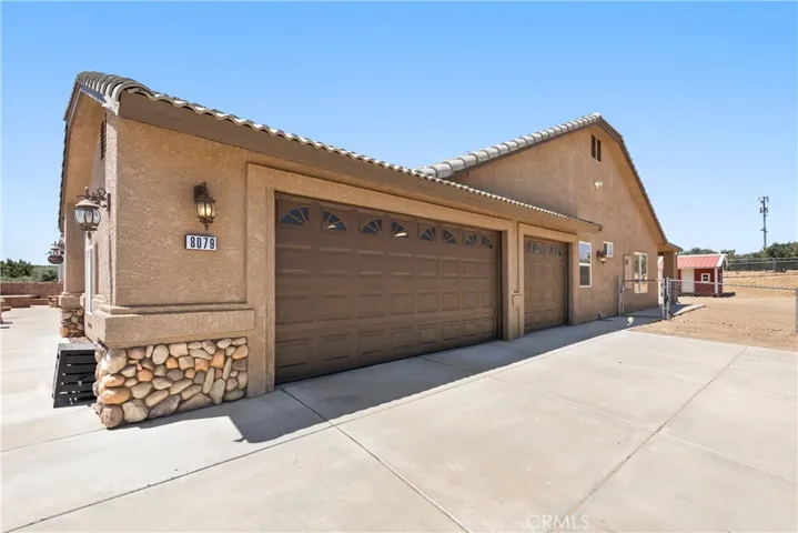 3 car garage on left side of home.
