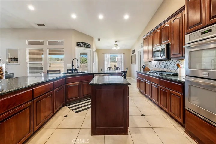 Kitchen with double islands and double ovens.