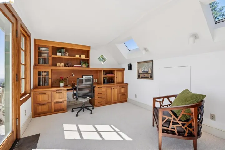 Integrated wood cabinetry and shelving provide extensive storage