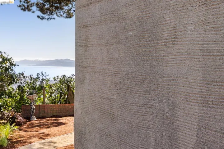 Unique durable extured exterior wall finish called Scratch Coat