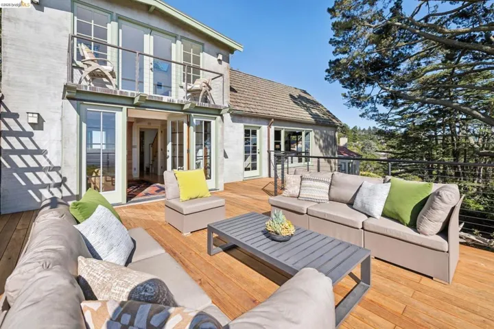 Expansive wood-finish deck featuring a cable railing system