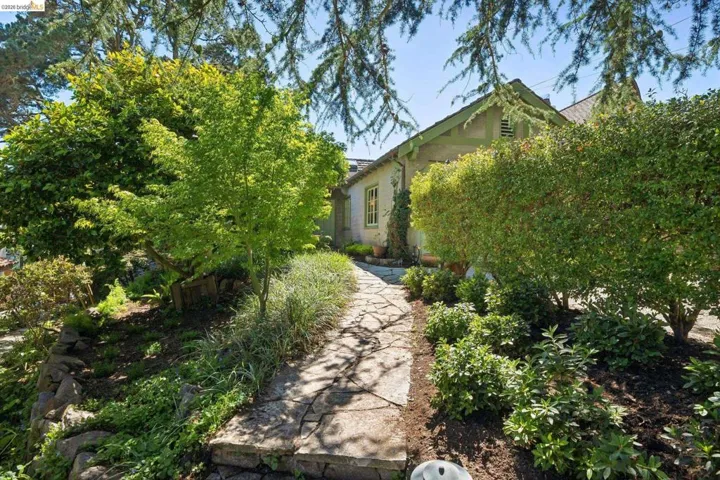 Stone pathway leading to front patio and main entry