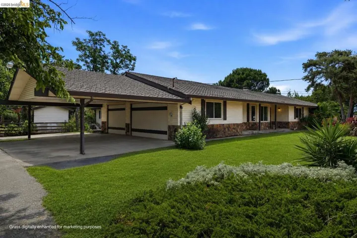 Virtually staged to show property's grass during Spring.