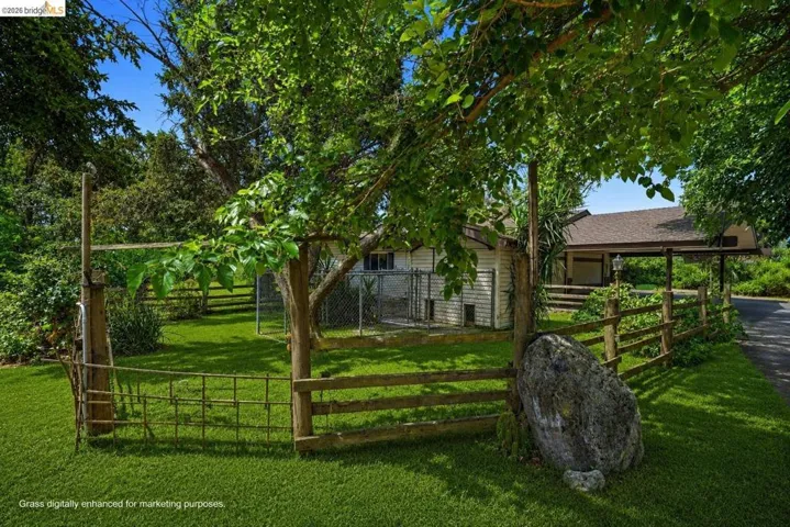 Virtually staged to show property's grass during Spring.