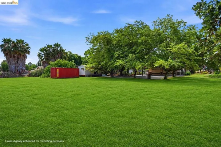 Virtually staged to show property's grass during Spring.