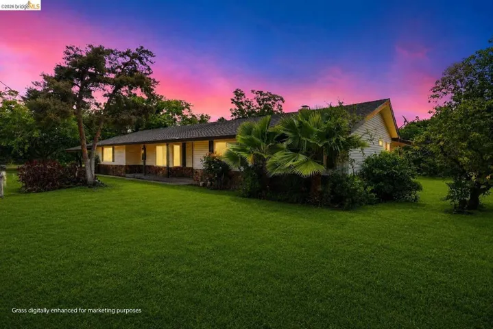 Virtually staged to show property's grass during Spring.