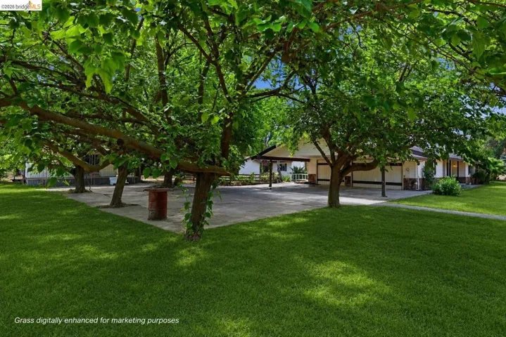 Virtually staged to show property's grass during Spring.