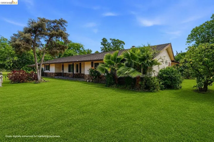 Virtually staged to show property's grass during Spring.