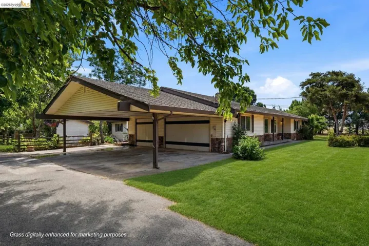 Virtually staged to show property's grass during Spring.