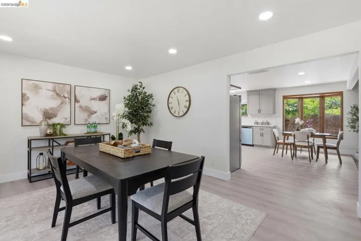 Dining area with partial view of kitchen breakfast nook