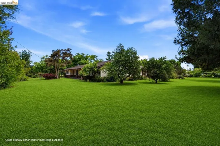 Virtually staged to show property's grass during Spring.
