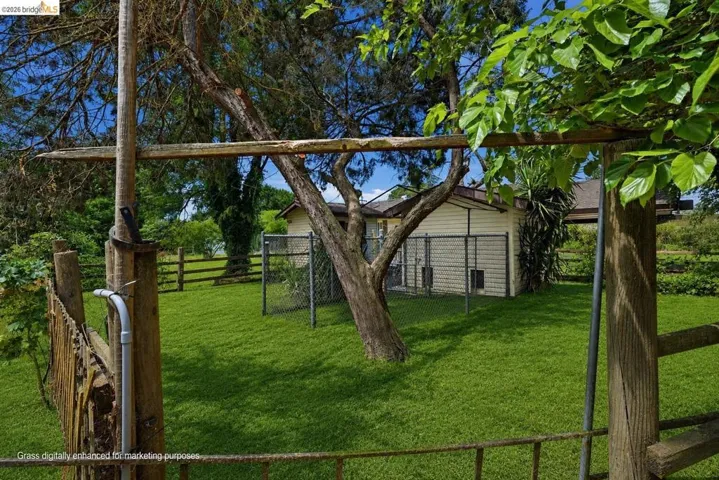 Virtually staged to show property's grass during Spring.