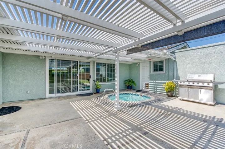 Private back yard with relaxing spa and BBQ.