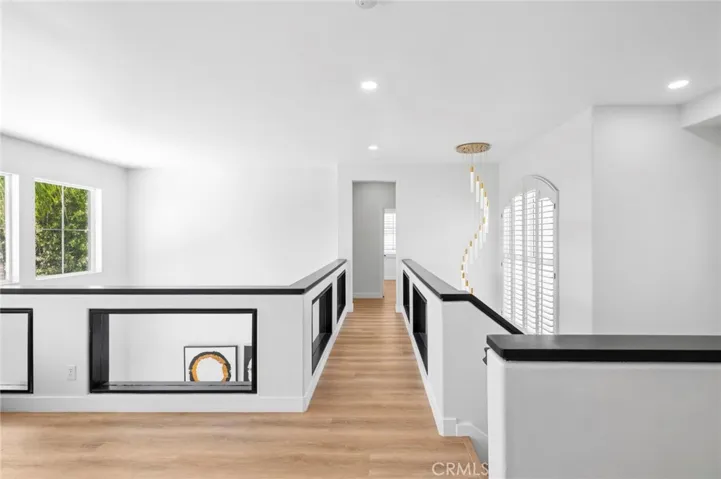 Hallway with Chandelier from High Ceiling
