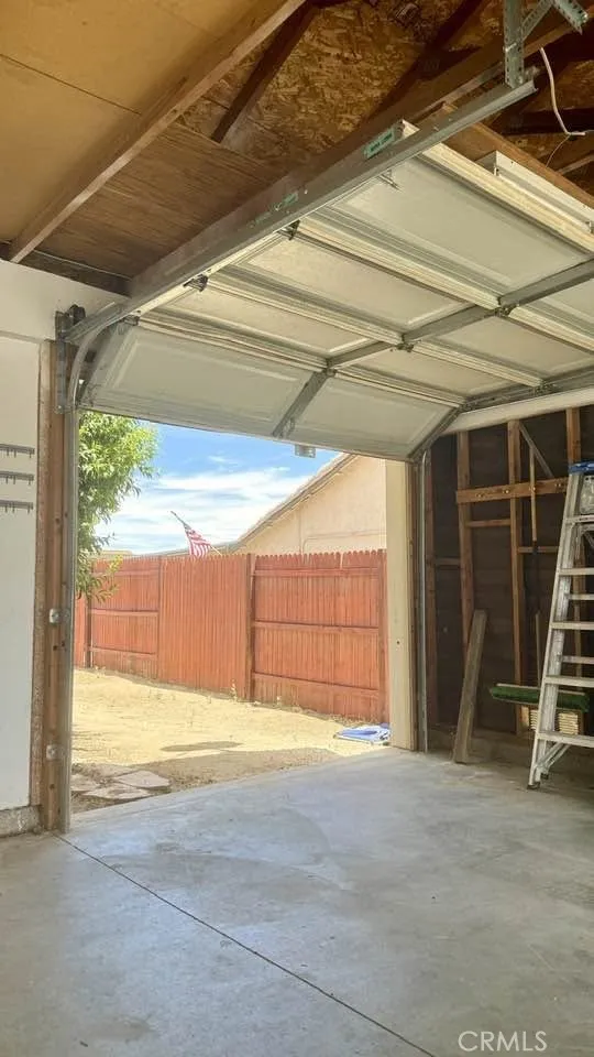 Tandem garage with a rear roll-up door. Tandem garage with a rear roll-up door.