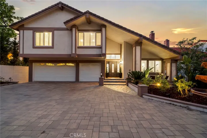 Exquisite hilltop estate and the largest model in Anaheim Hills’ exclusive Ridgeview community, ideally situated on a private flag lot with a long paver driveway on a quiet double cul-de-sac street