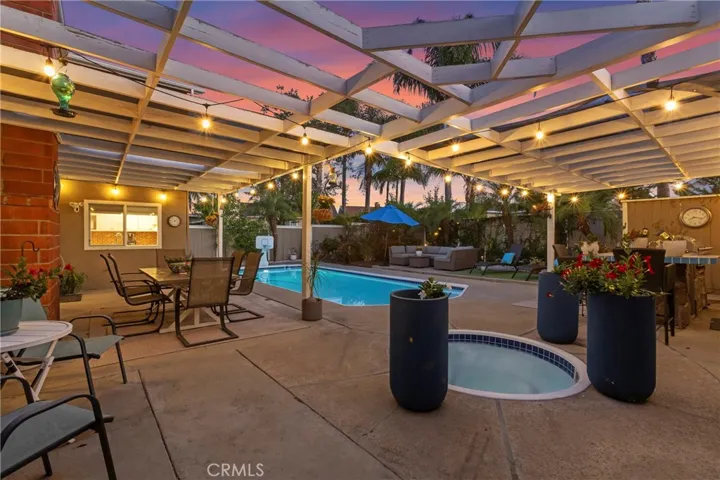 Outdoor living space, swimming poo, spa, and BBQ island