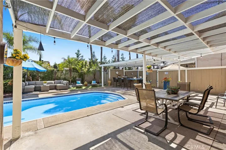 Outdoor living space, swimming poo, spa, and BBQ island