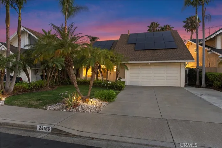 Evening perspective of the front of the home.