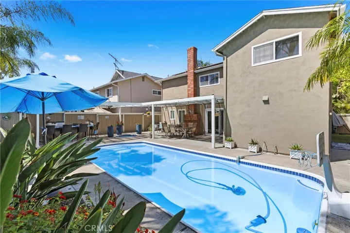 View of backyard with pool and spa