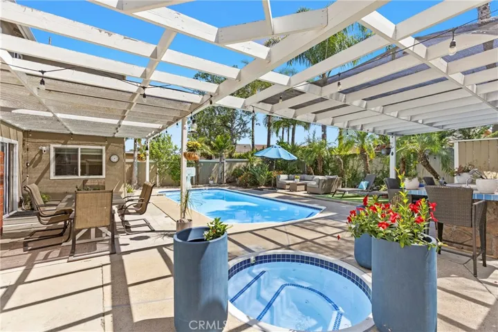 Outdoor living space, swimming poo, spa, and BBQ island