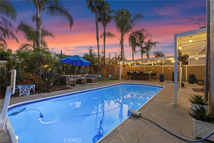 Epic outdoor entertaining space with pool, spa, BBQ island, and lounging area.