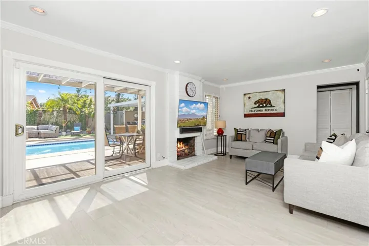 Family room with direct access to backyard and views of swimming pool