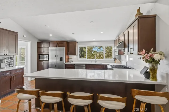Open kitchen with tennis court views