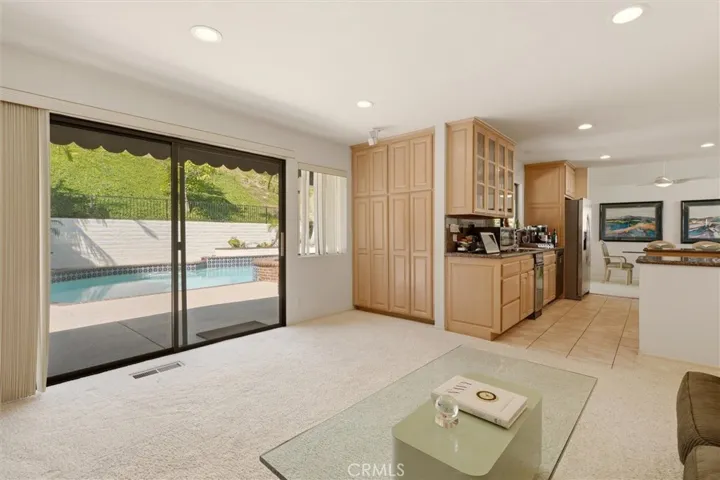 family room with view of pool for indoor/outdoor feel