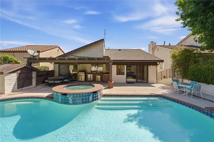 Heated Pool and Spa with outdoor bar and kitchen area