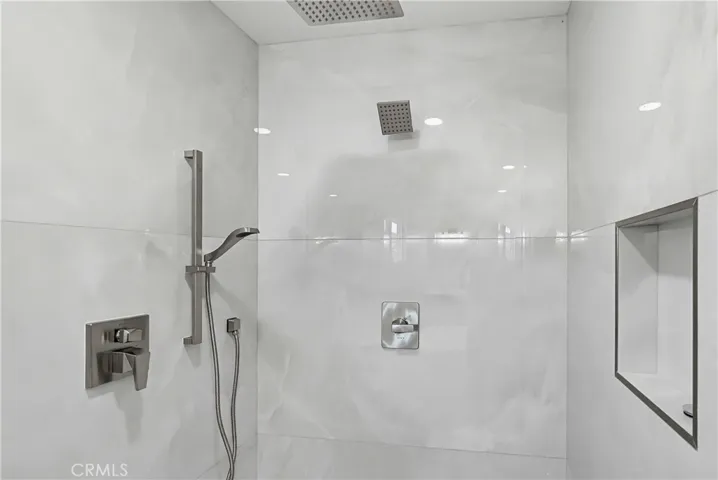 Oversized shower with multiple heads