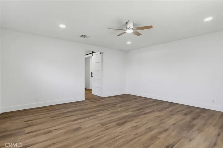 Primary bedroom w/LED lighting and ceiling fan
