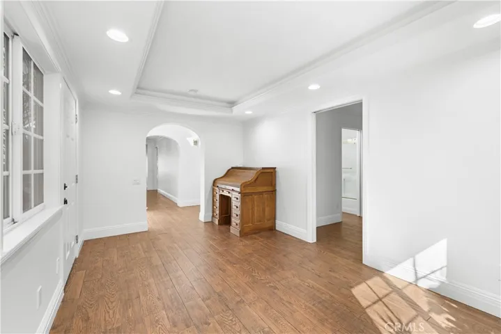 View from office looking back towards foyer.  Bedroom # 5 is to the right with a pocket door.